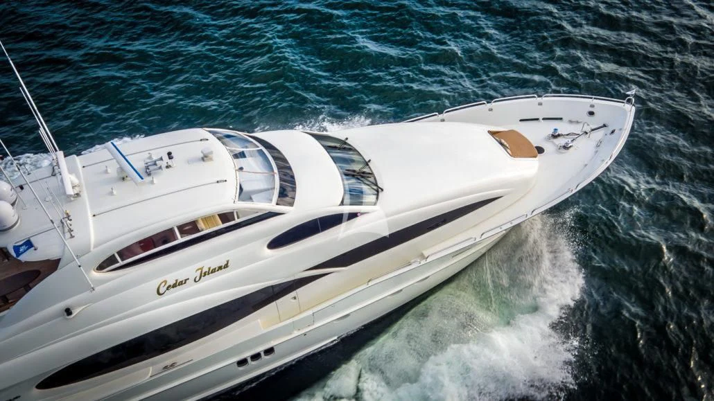a white yacht on the water aboard CEDAR ISLAND Yacht for Sale
