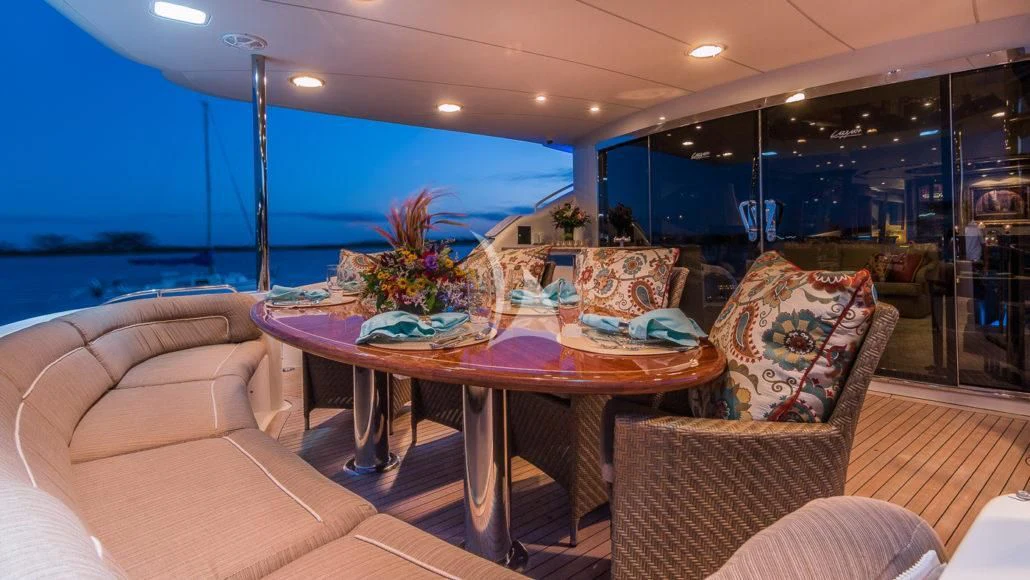 a dining table in a room aboard CEDAR ISLAND Yacht for Sale