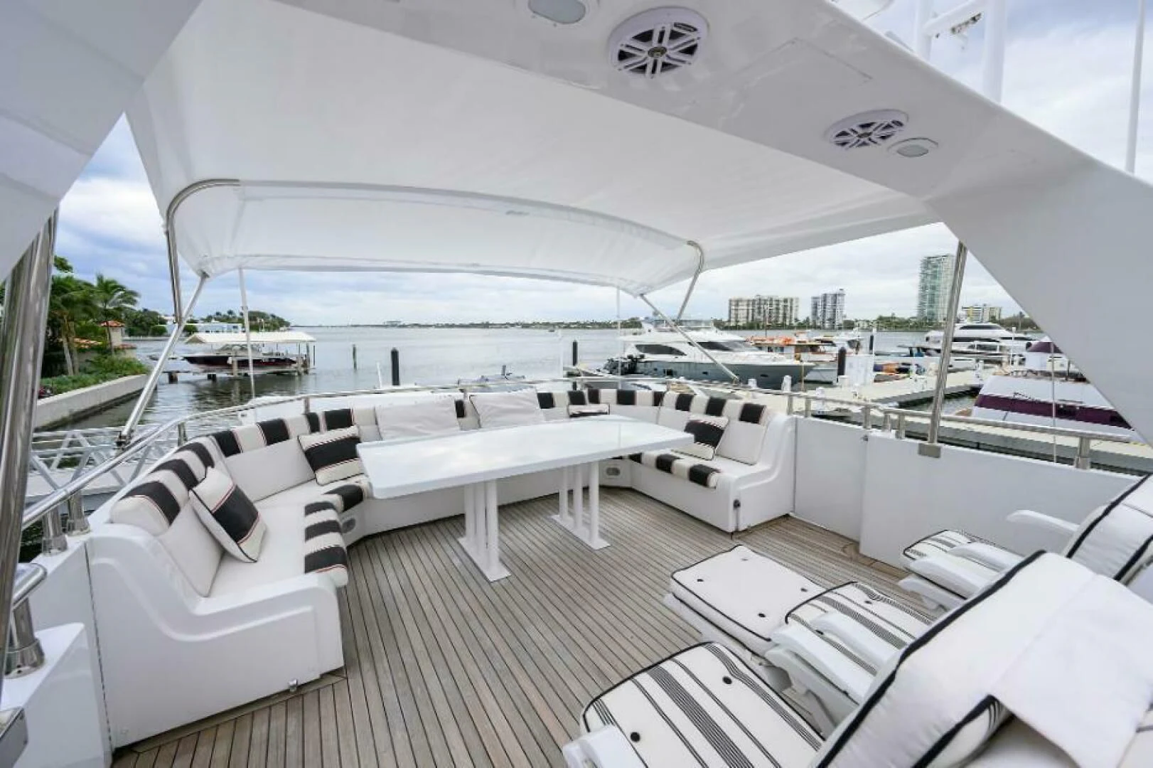 a large white tent with chairs and tables aboard CIPANGO Yacht for Sale