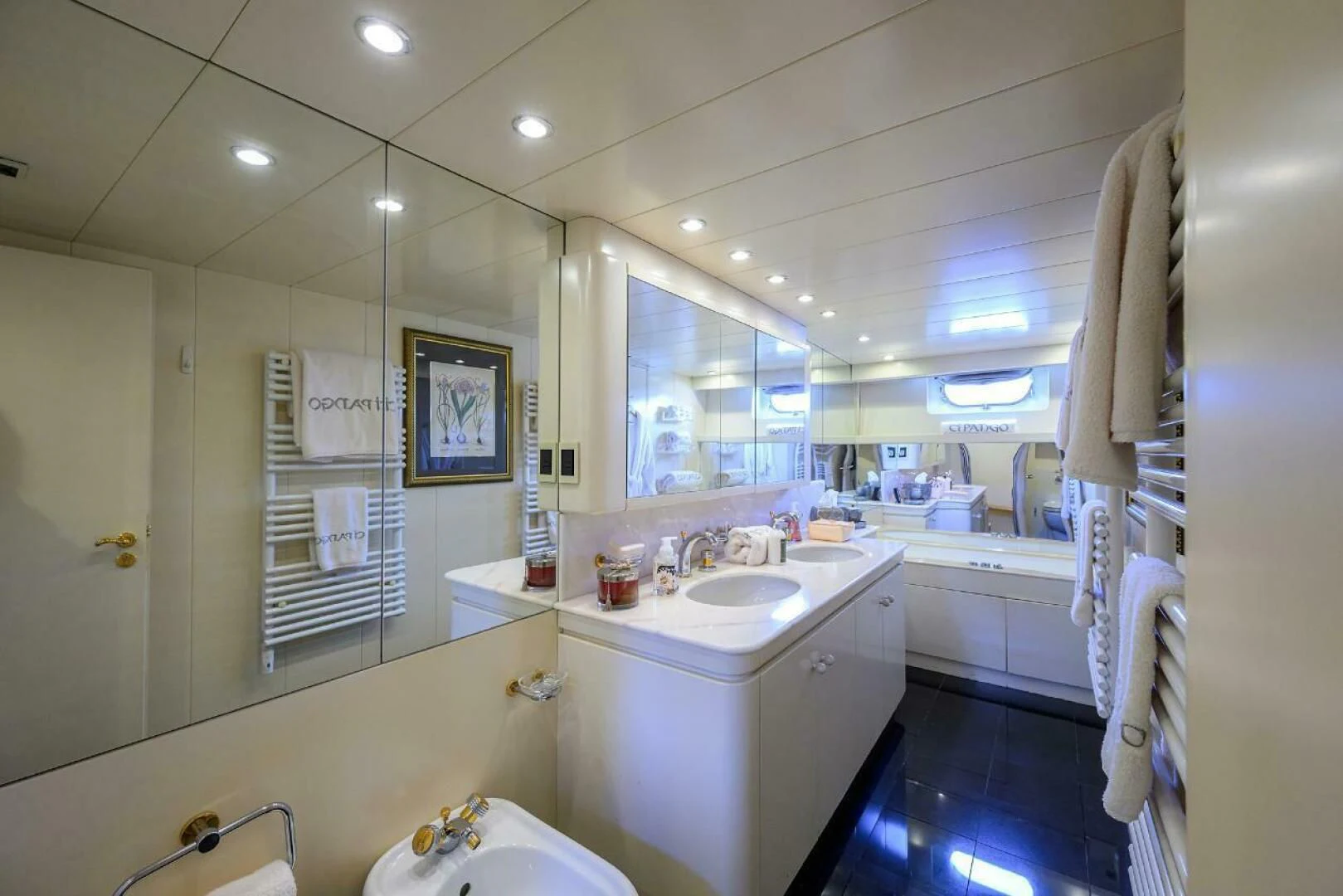 a bathroom with a sink and a mirror aboard CIPANGO Yacht for Sale