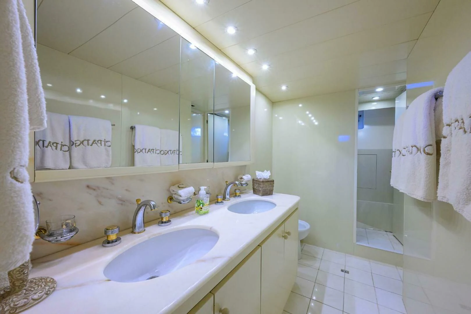 a bathroom with a sink and a mirror aboard CIPANGO Yacht for Sale