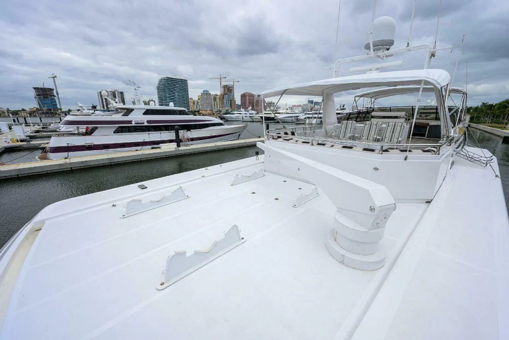 a large white boat in a harbor aboard CIPANGO Yacht for Sale