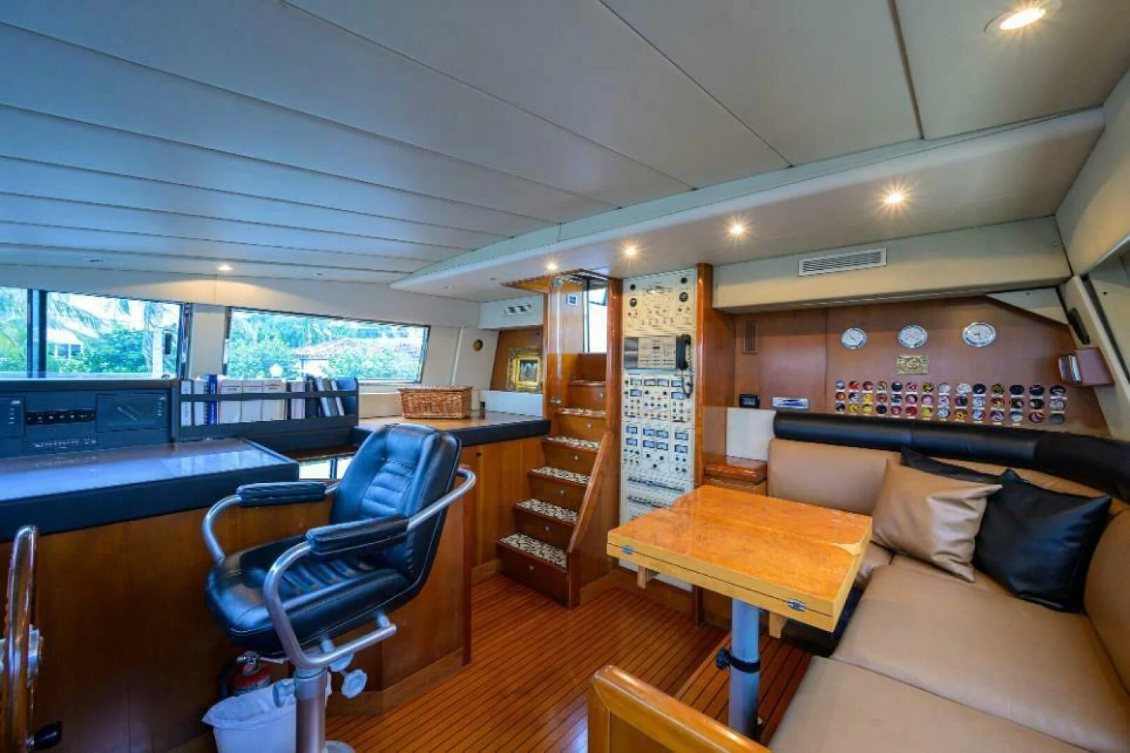 a room with a couch and a table and chairs aboard CIPANGO Yacht for Sale