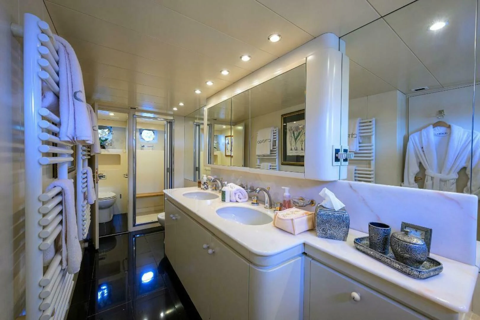 a bathroom with a sink and a mirror aboard CIPANGO Yacht for Sale