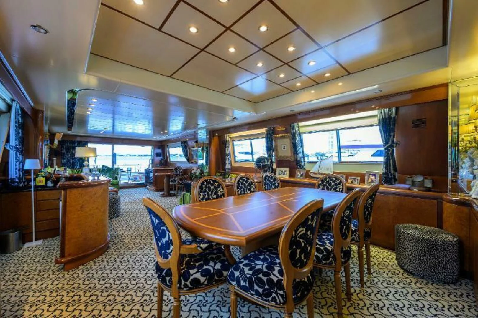 a large room with a table and chairs aboard CIPANGO Yacht for Sale