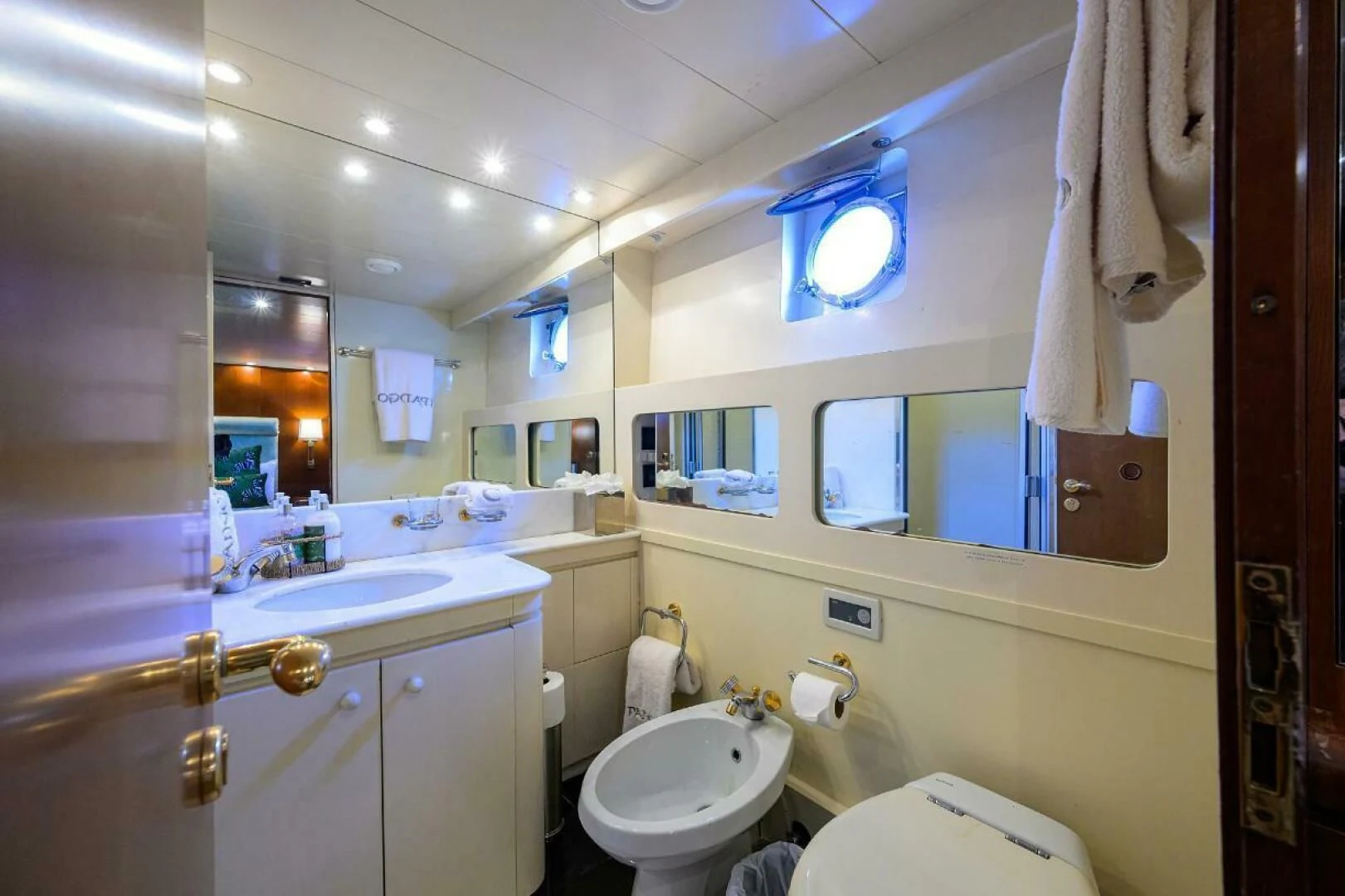 a bathroom with a toilet and sink aboard CIPANGO Yacht for Sale