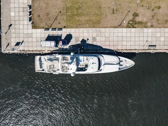a white car with a black and white logo on it aboard ARCTIC PRIDE II Yacht for Sale