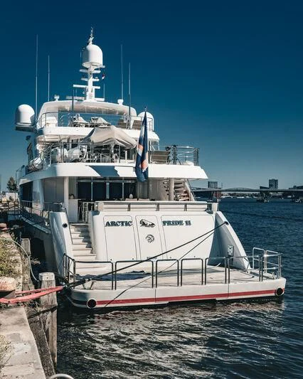 a boat docked at a dock aboard ARCTIC PRIDE II Yacht for Sale