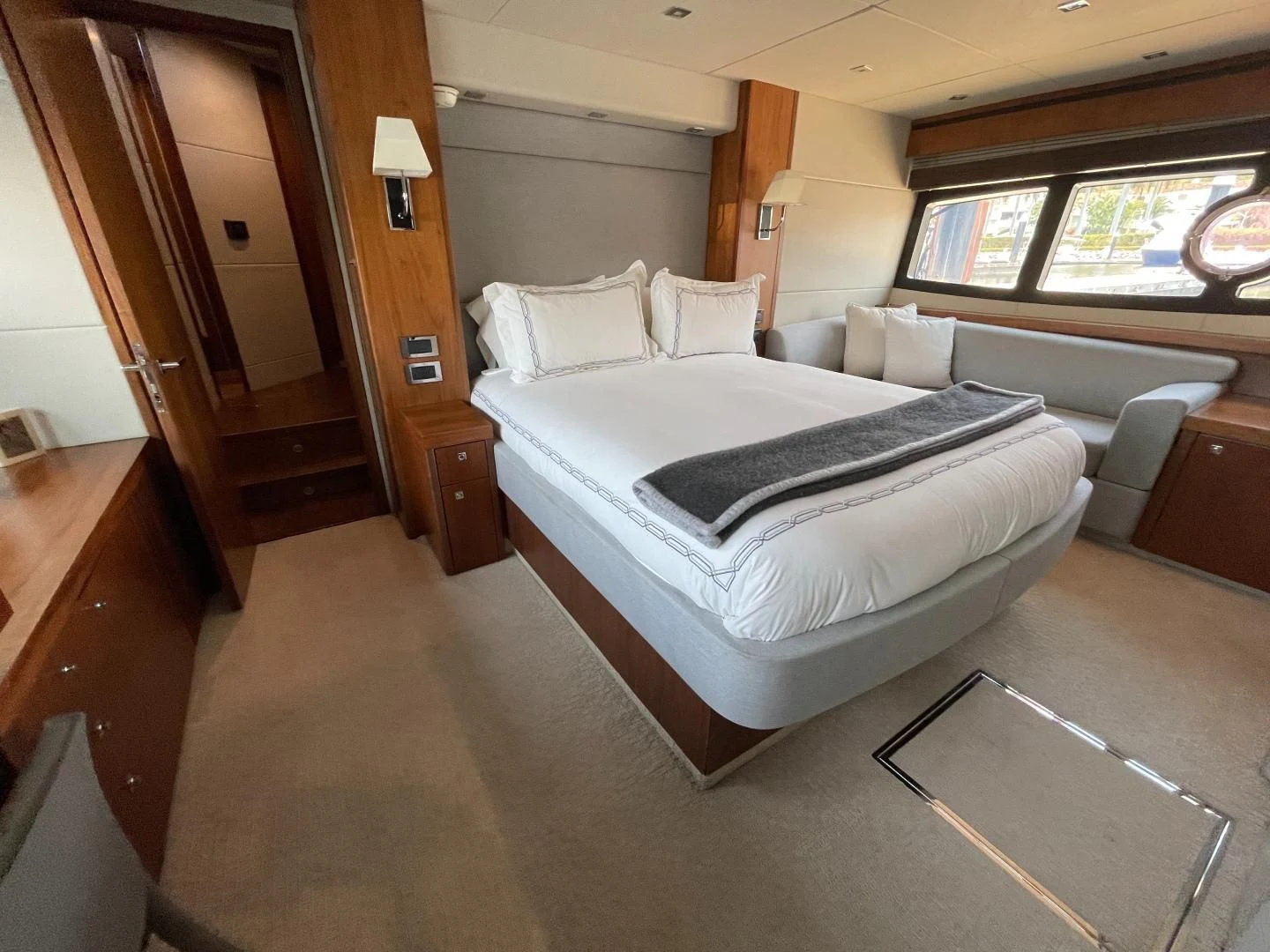 a room with a bed and a couch aboard TRAINERA Yacht for Sale