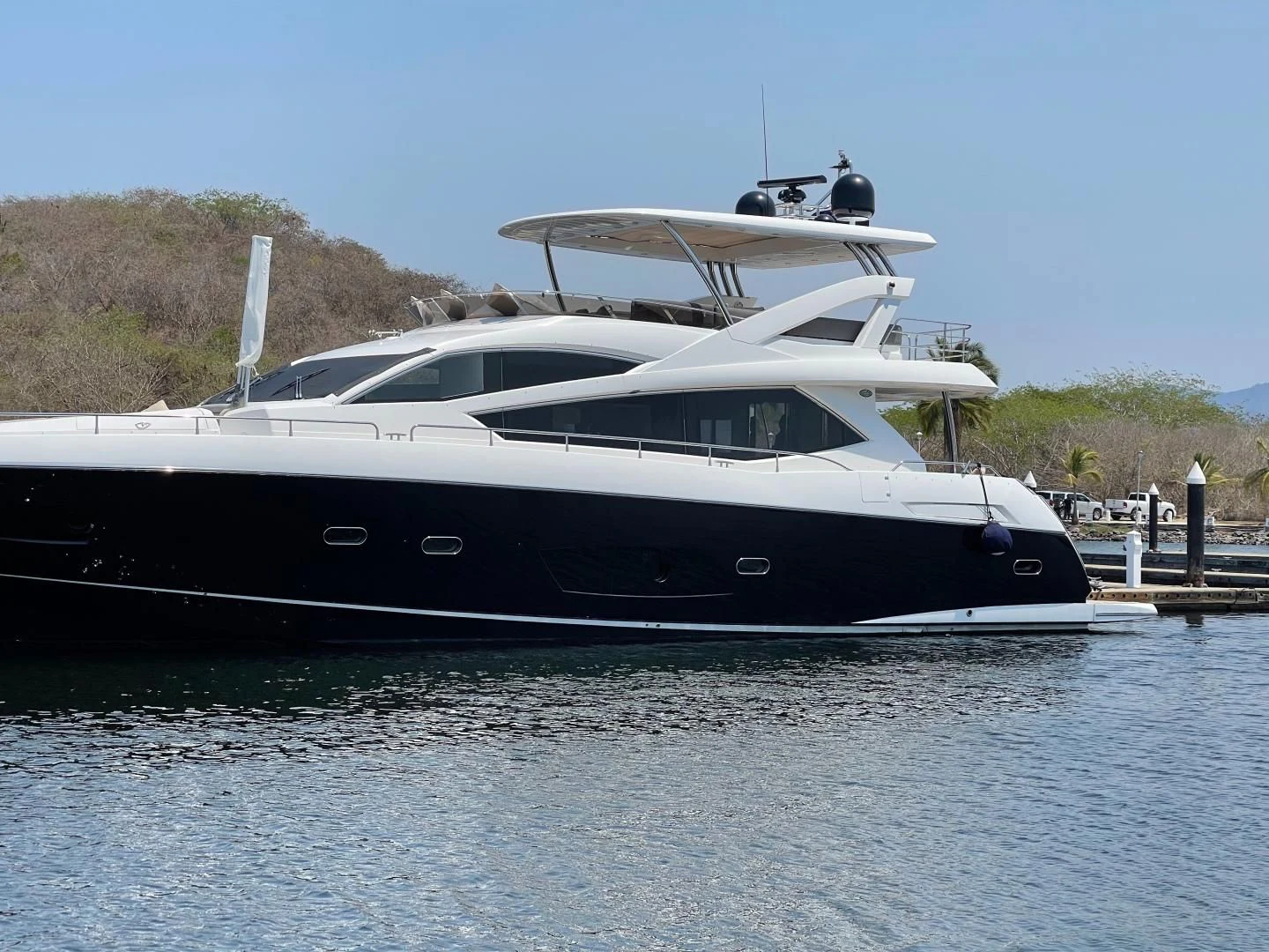a boat docked at a pier aboard TRAINERA Yacht for Sale