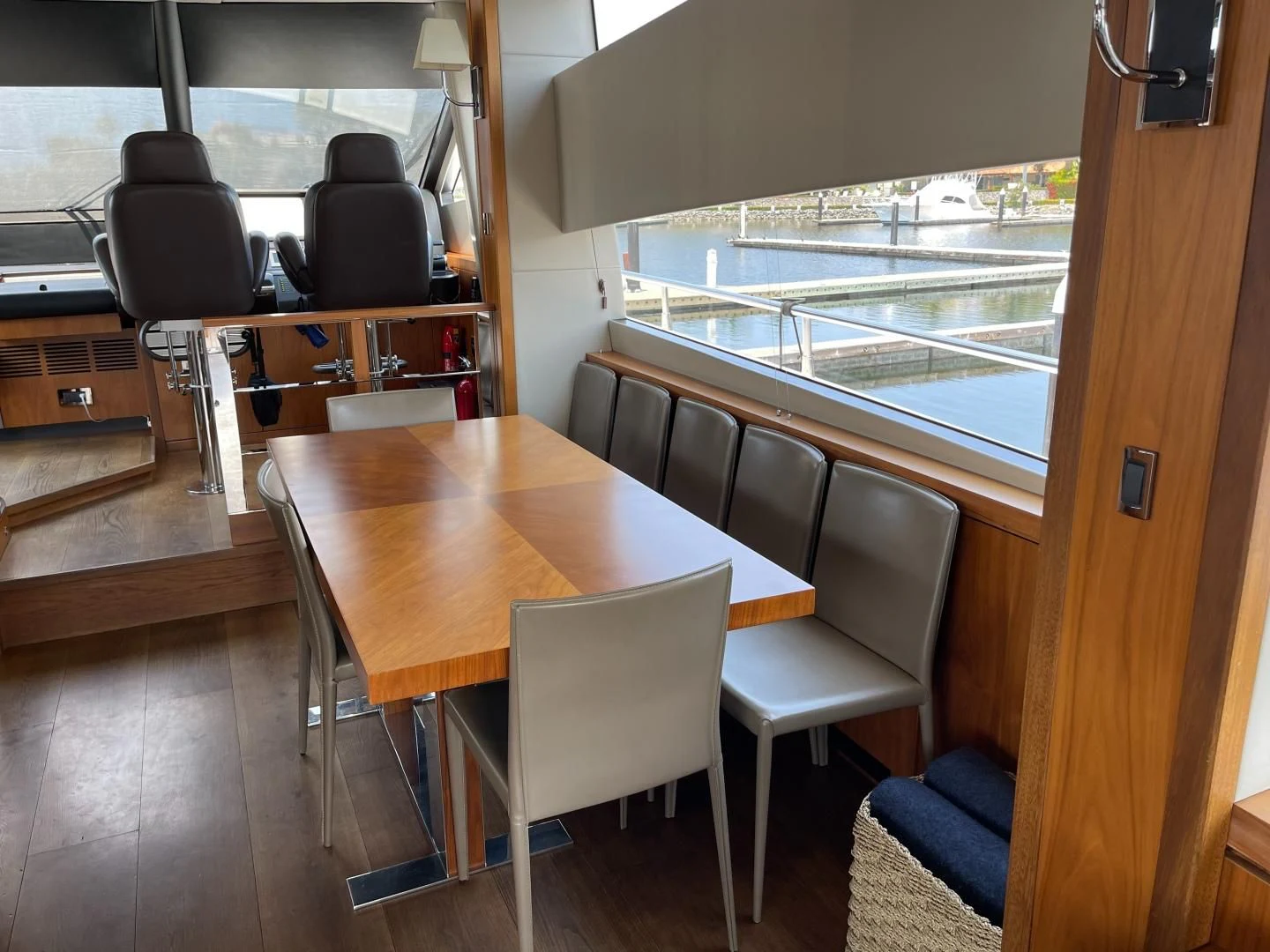 a table with chairs around it aboard TRAINERA Yacht for Sale