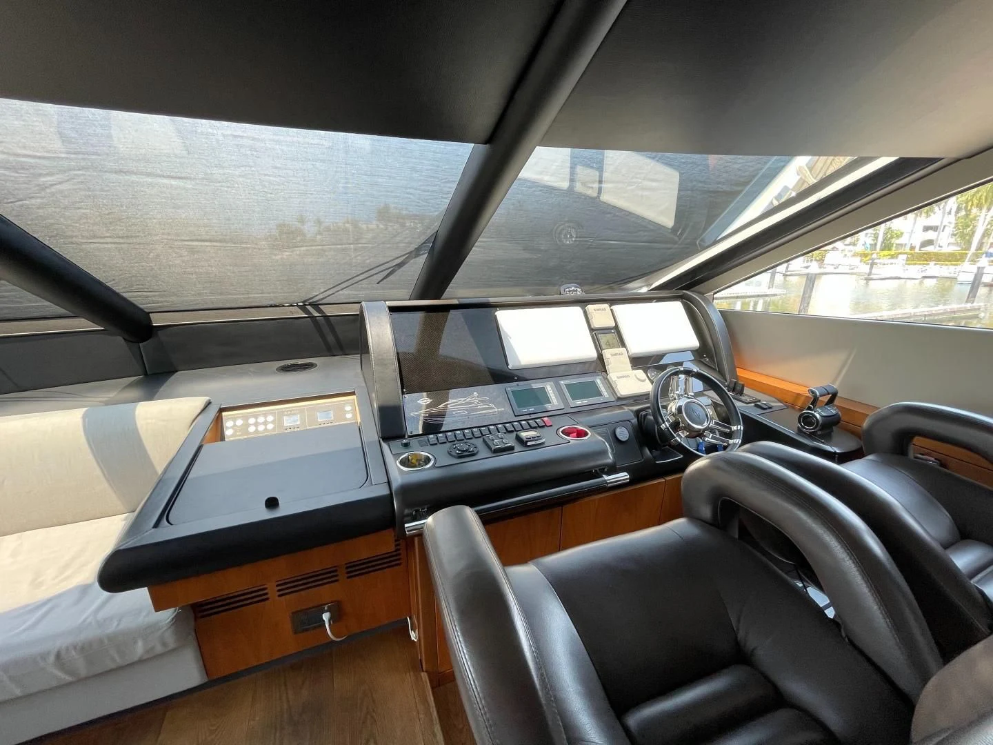 a vehicle with a desk and a computer on it aboard TRAINERA Yacht for Sale