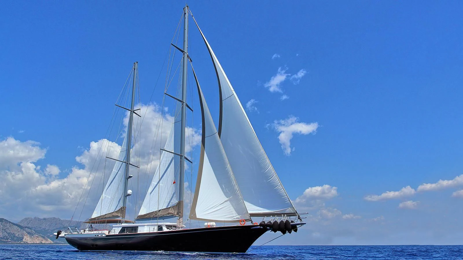 a sailboat on the water aboard MOSS Yacht for Sale