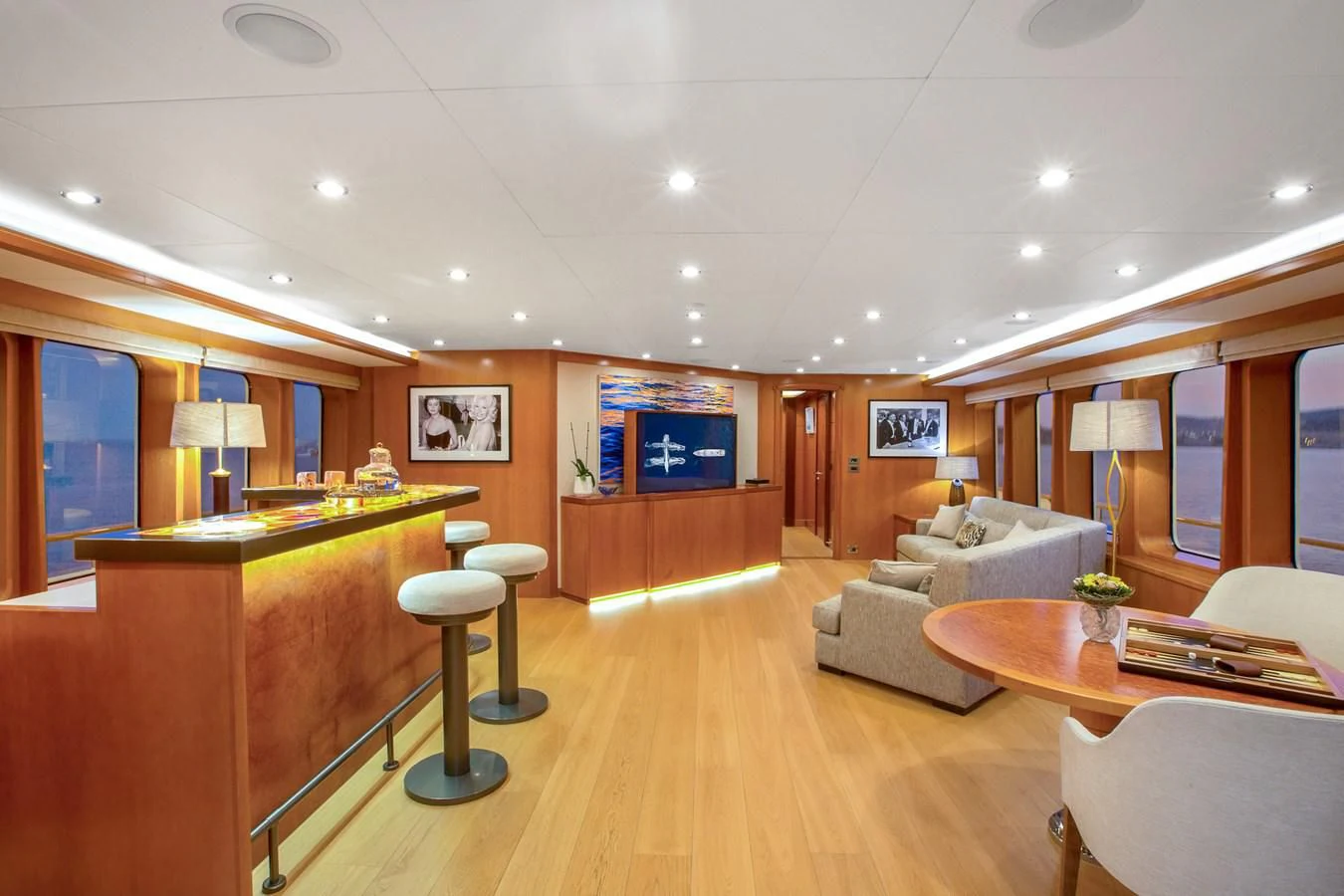 a living room with a desk and a couch aboard HERCULES Yacht for Sale