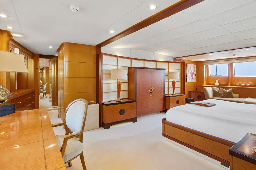 a room with a bed and a desk aboard HERCULES Yacht for Sale