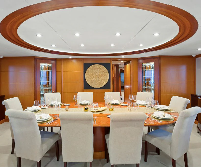 a large dining room table aboard HERCULES Yacht for Sale