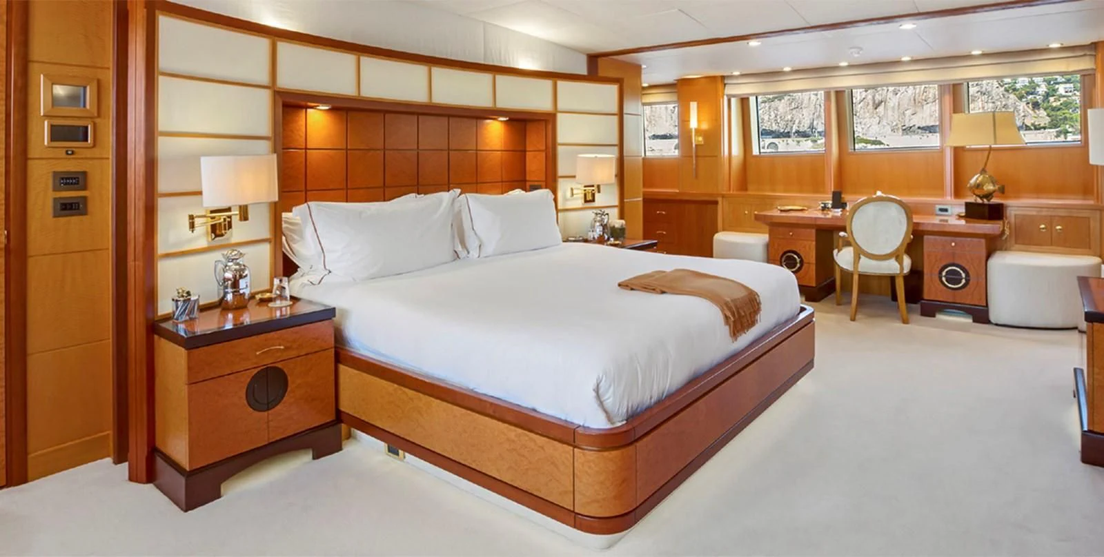 a room with a bed and desk aboard HERCULES Yacht for Sale
