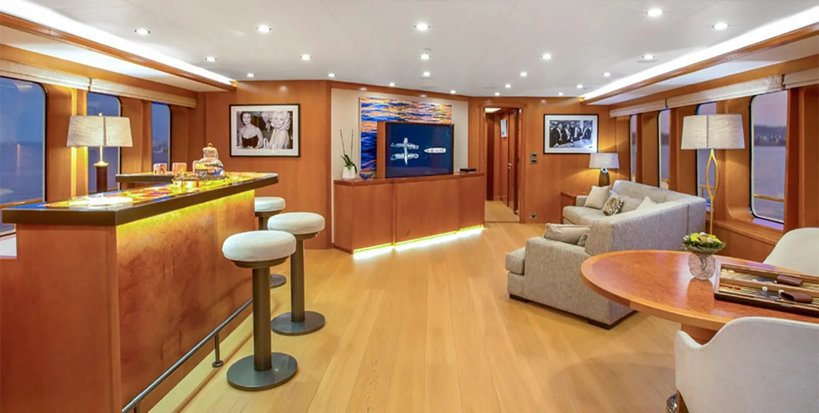 a living room with a tv and a couch aboard HERCULES Yacht for Sale
