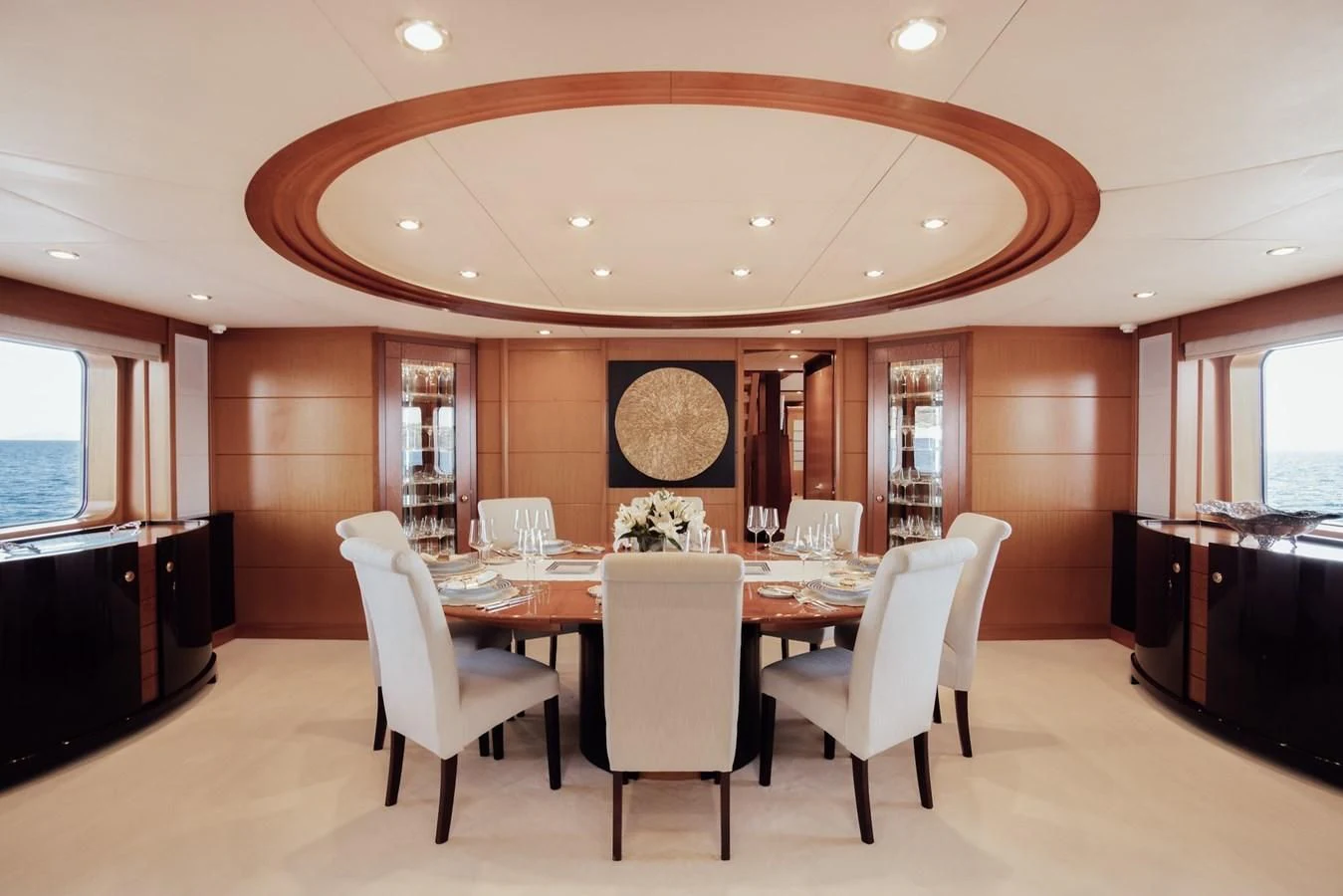 a large dining room with a table and chairs aboard HERCULES Yacht for Sale
