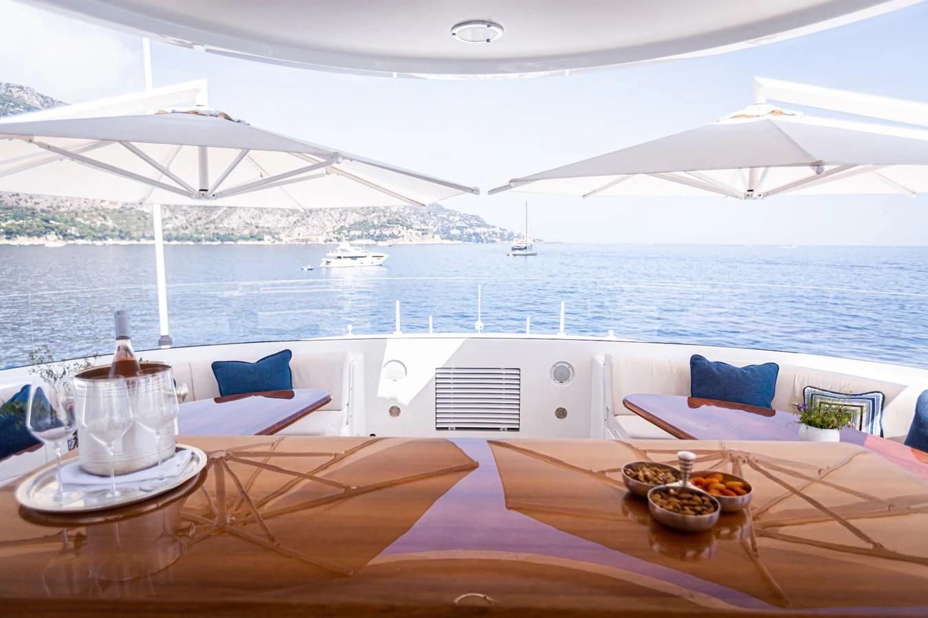 a table with food on it by a body of water aboard HERCULES Yacht for Sale