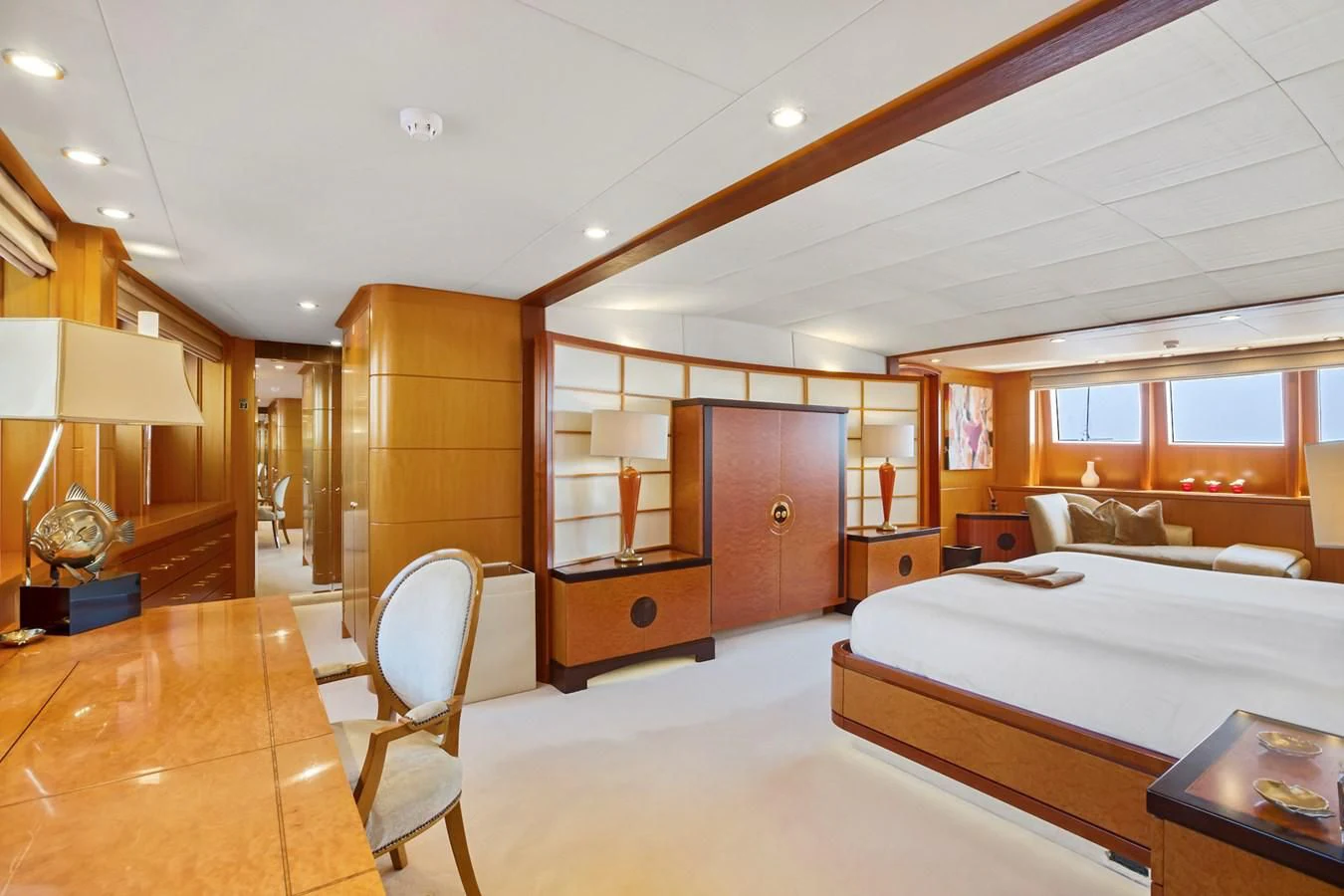 a bedroom with a bed and a desk aboard HERCULES Yacht for Sale