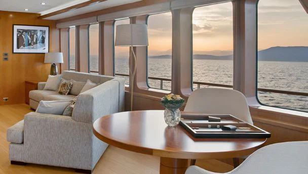 a living room with a large window aboard HERCULES Yacht for Sale