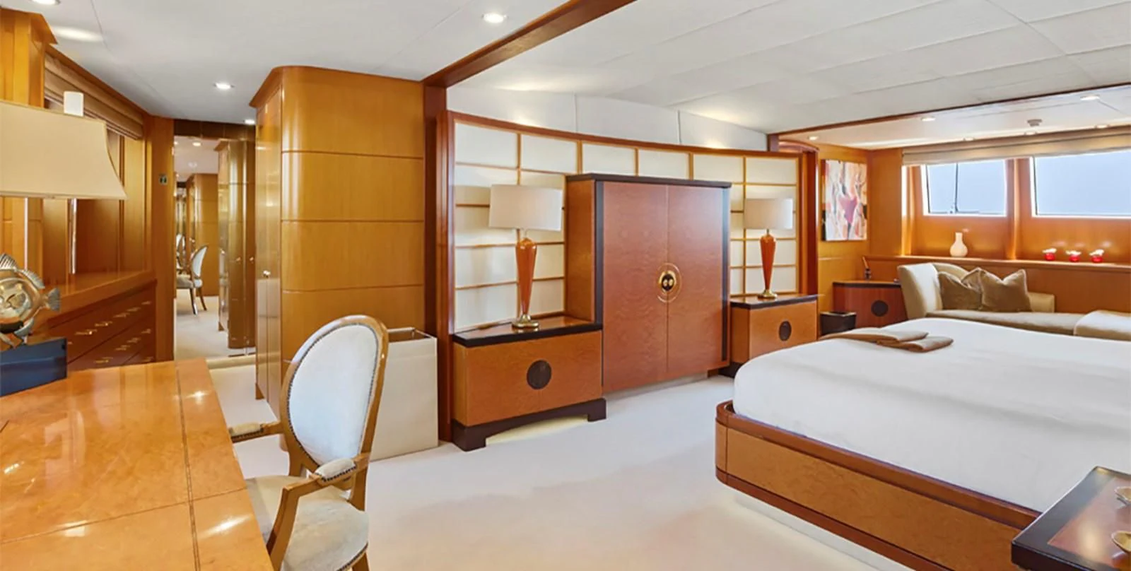 a room with a bed and a desk aboard HERCULES Yacht for Sale