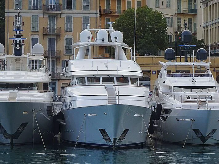 several boats docked in a harbor aboard HERCULES Yacht for Sale