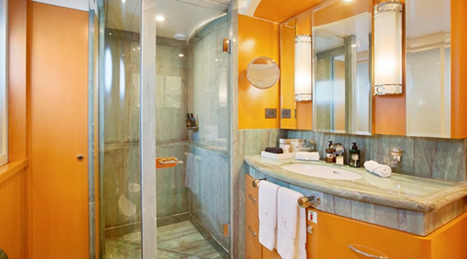 a bathroom with a glass shower aboard HERCULES Yacht for Sale