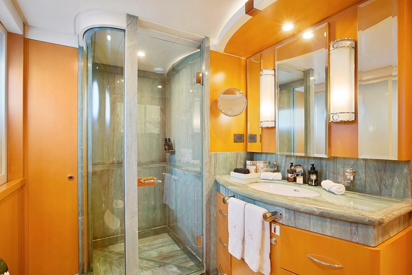a bathroom with a glass shower aboard HERCULES Yacht for Sale