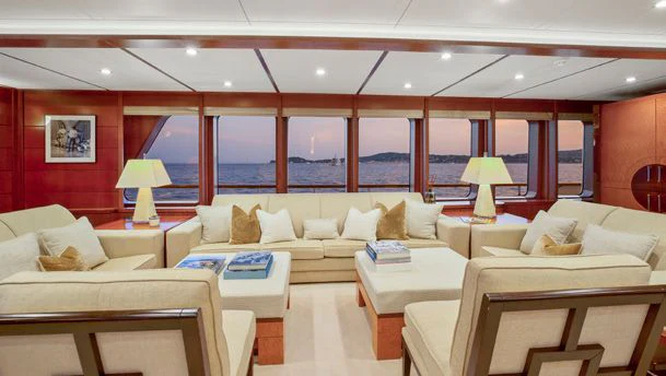 a living room with a large window aboard HERCULES Yacht for Sale