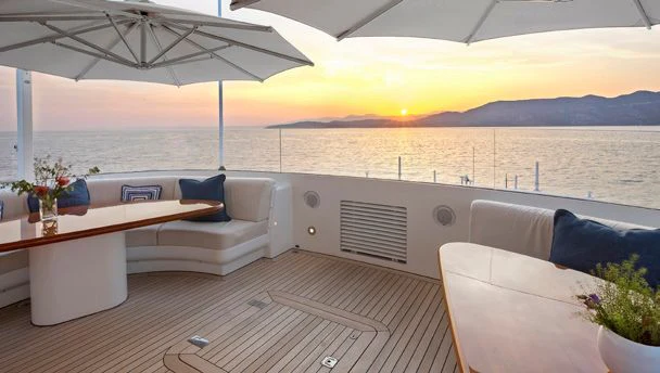 a room with a table and chairs aboard HERCULES Yacht for Sale