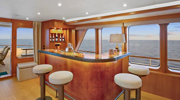 a bar with a bar and stools aboard HERCULES Yacht for Sale