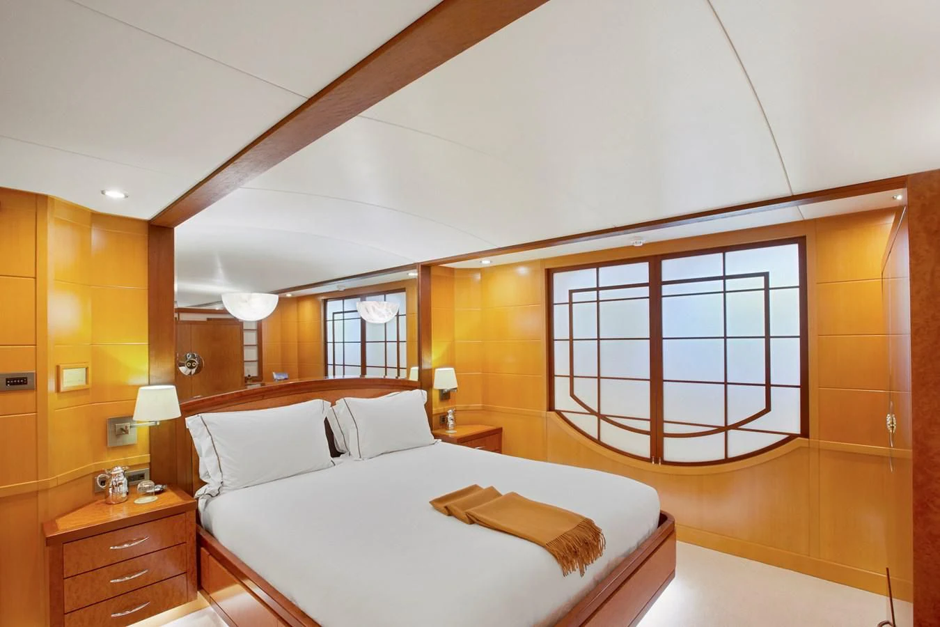 a bedroom with a bed and a window aboard HERCULES Yacht for Sale