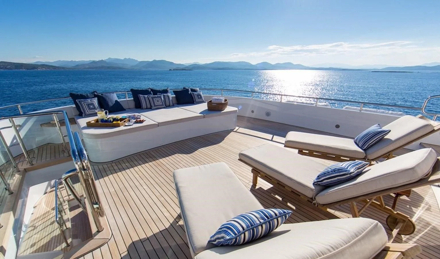 a large balcony overlooking a large body of water aboard HERCULES Yacht for Sale