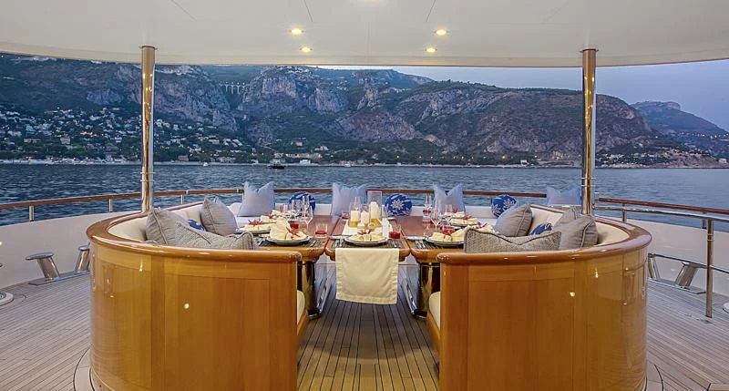 a room with a table and chairs aboard HERCULES Yacht for Sale