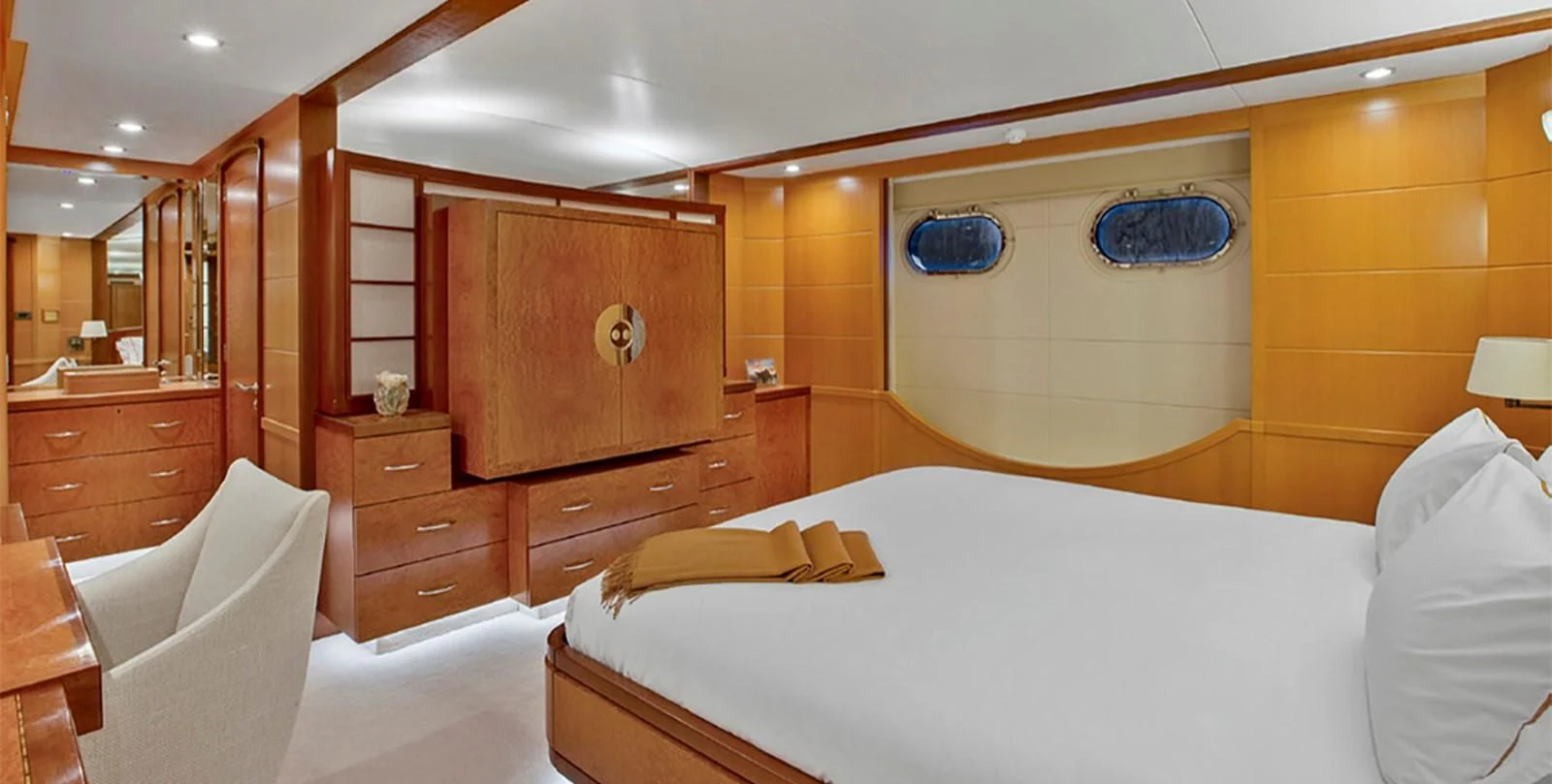 a room with a bed and a mirror aboard HERCULES Yacht for Sale