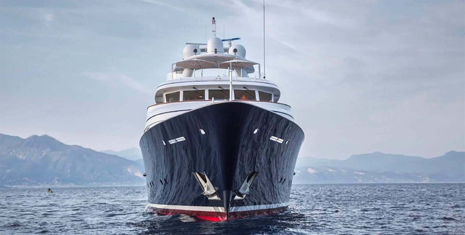 a large ship in the water aboard HERCULES Yacht for Sale