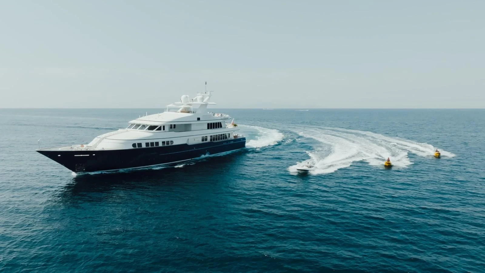 a couple of boats in the water aboard HERCULES Yacht for Sale