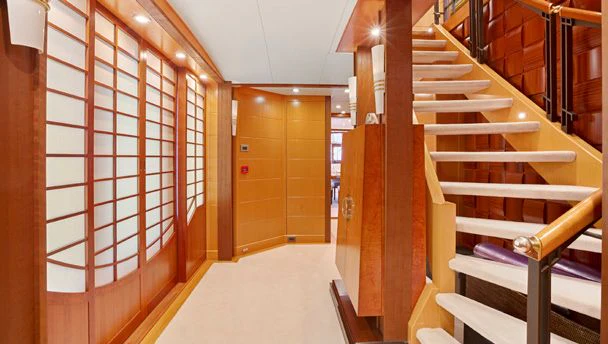 a room with wooden stairs aboard HERCULES Yacht for Sale