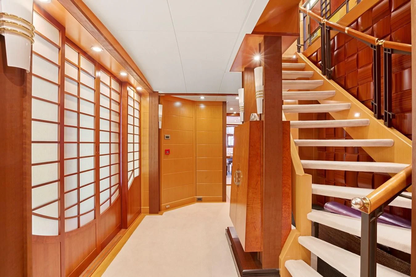 a room with wooden stairs aboard HERCULES Yacht for Sale
