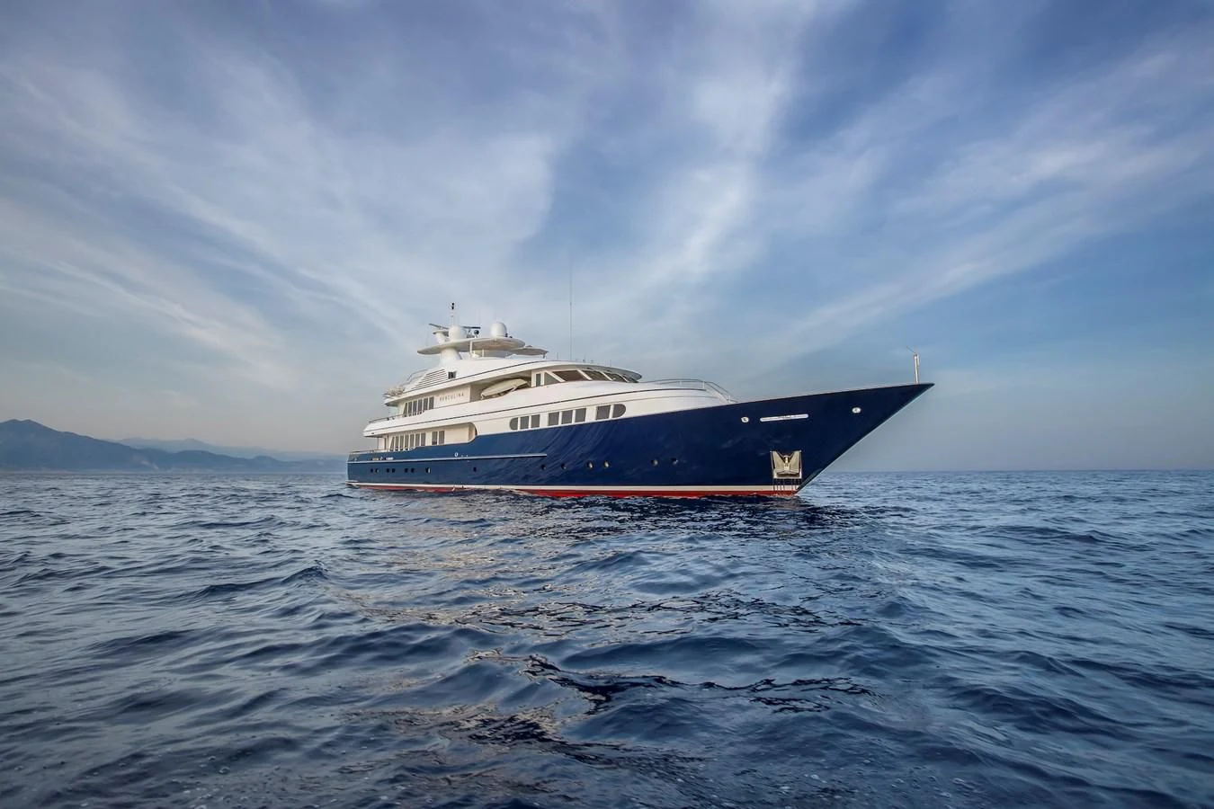 a large boat in the water aboard HERCULES Yacht for Sale