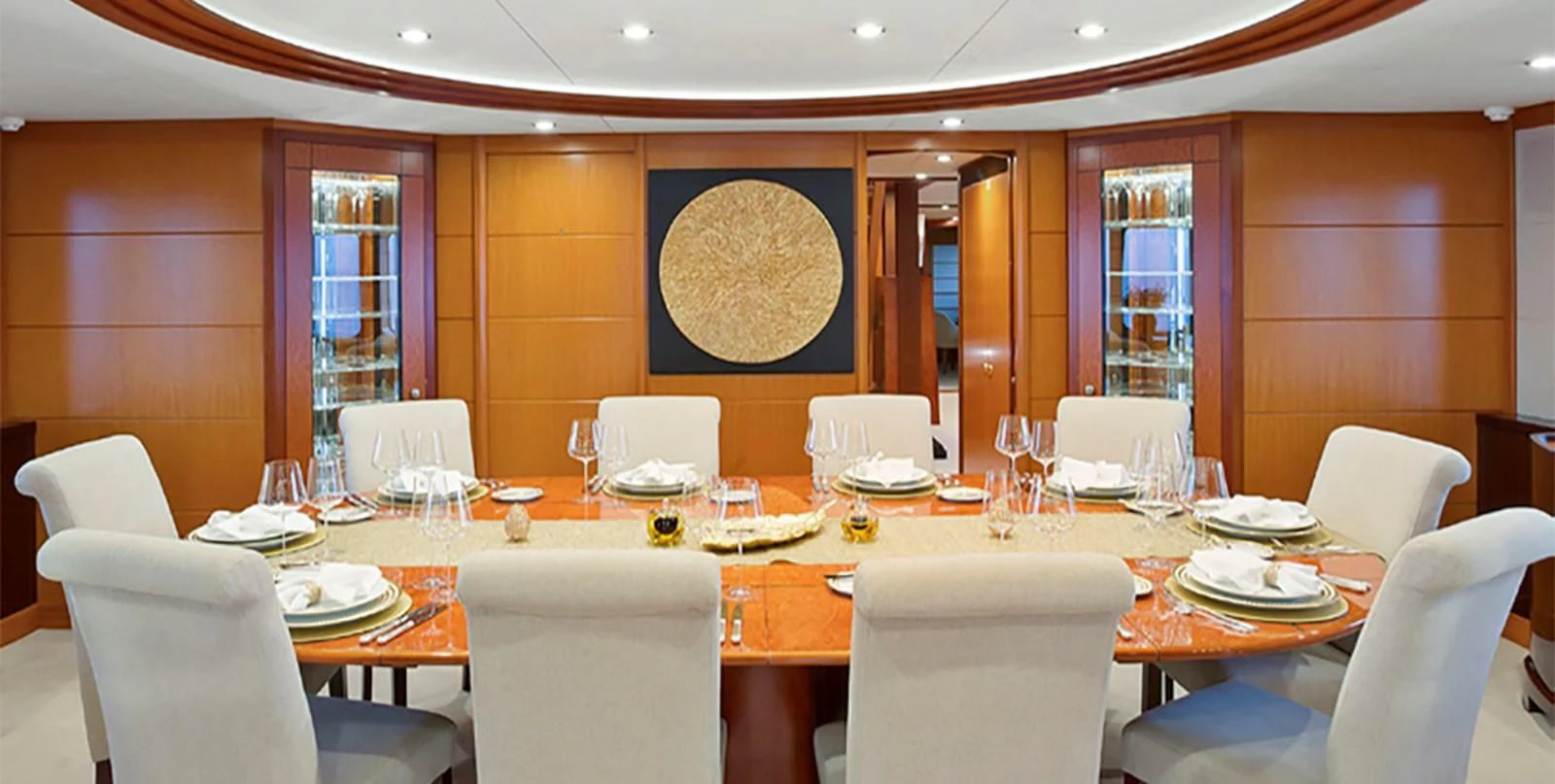 a large room with tables and chairs aboard HERCULES Yacht for Sale