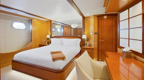 a room with a bed and a desk aboard HERCULES Yacht for Sale