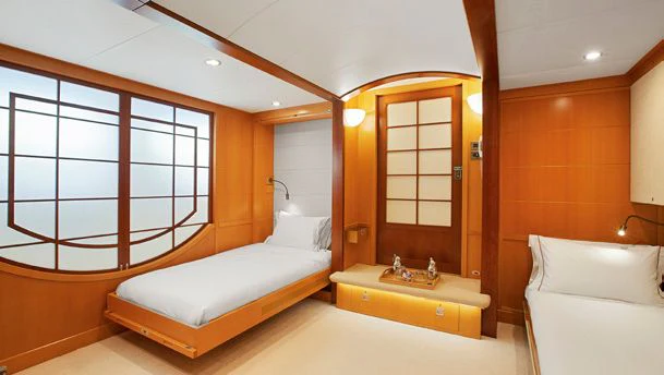 a room with two beds aboard HERCULES Yacht for Sale