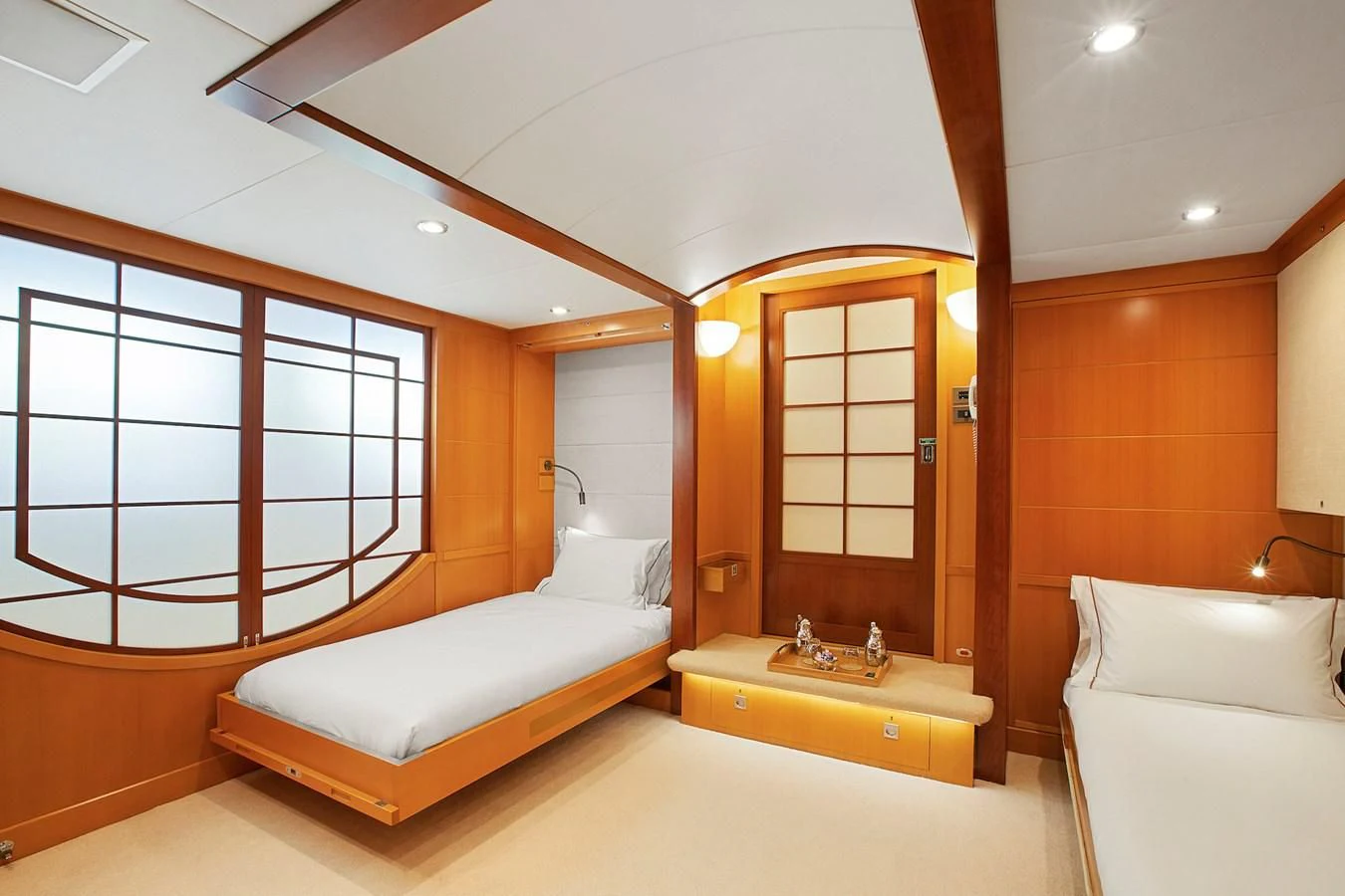 a room with a bed and a mirror aboard HERCULES Yacht for Sale