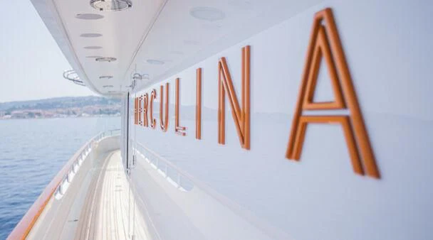 a large white boat with orange stripes aboard HERCULES Yacht for Sale