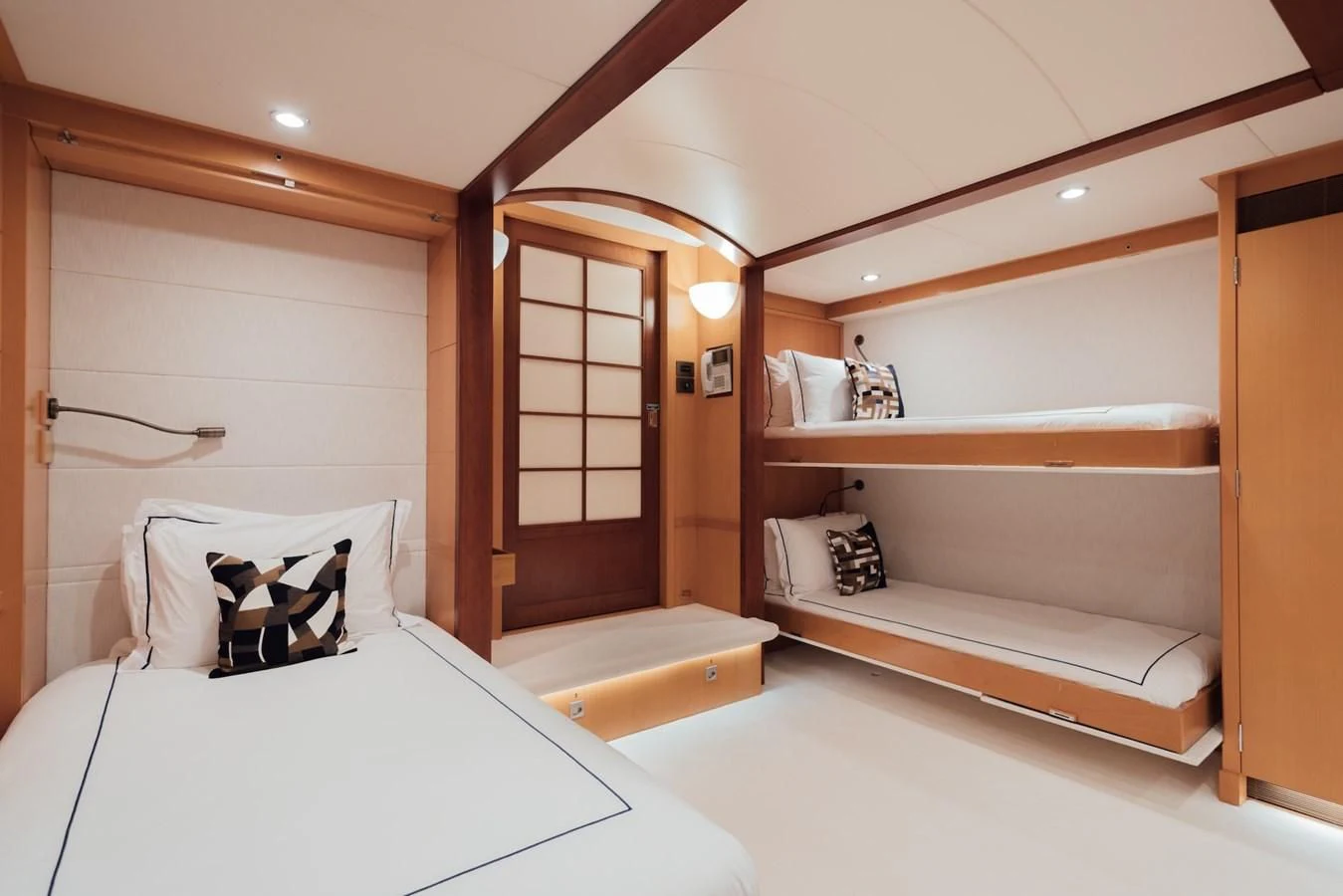 a room with a bed and a closet aboard HERCULES Yacht for Sale