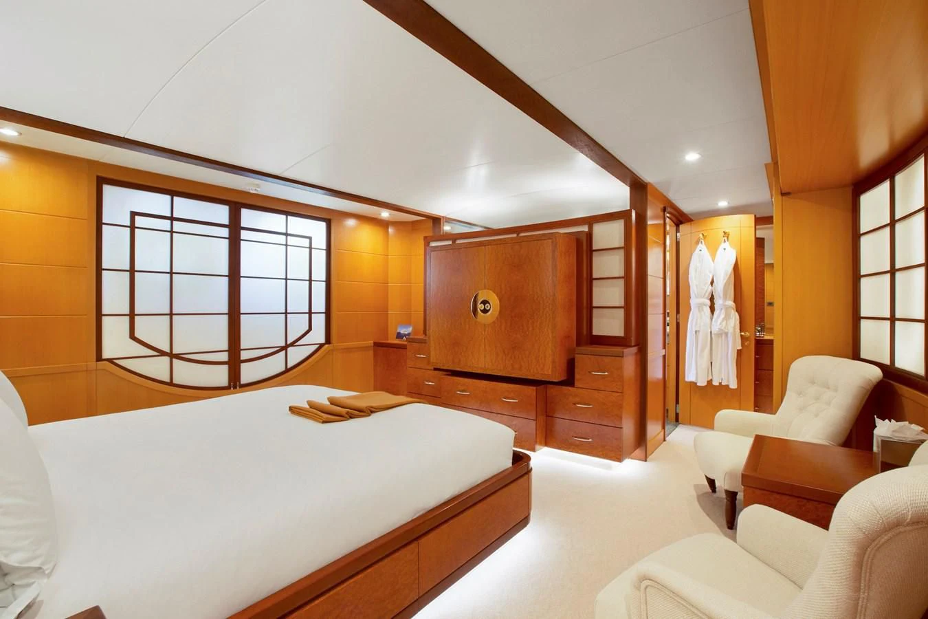 a bedroom with a bed and a mirror aboard HERCULES Yacht for Sale