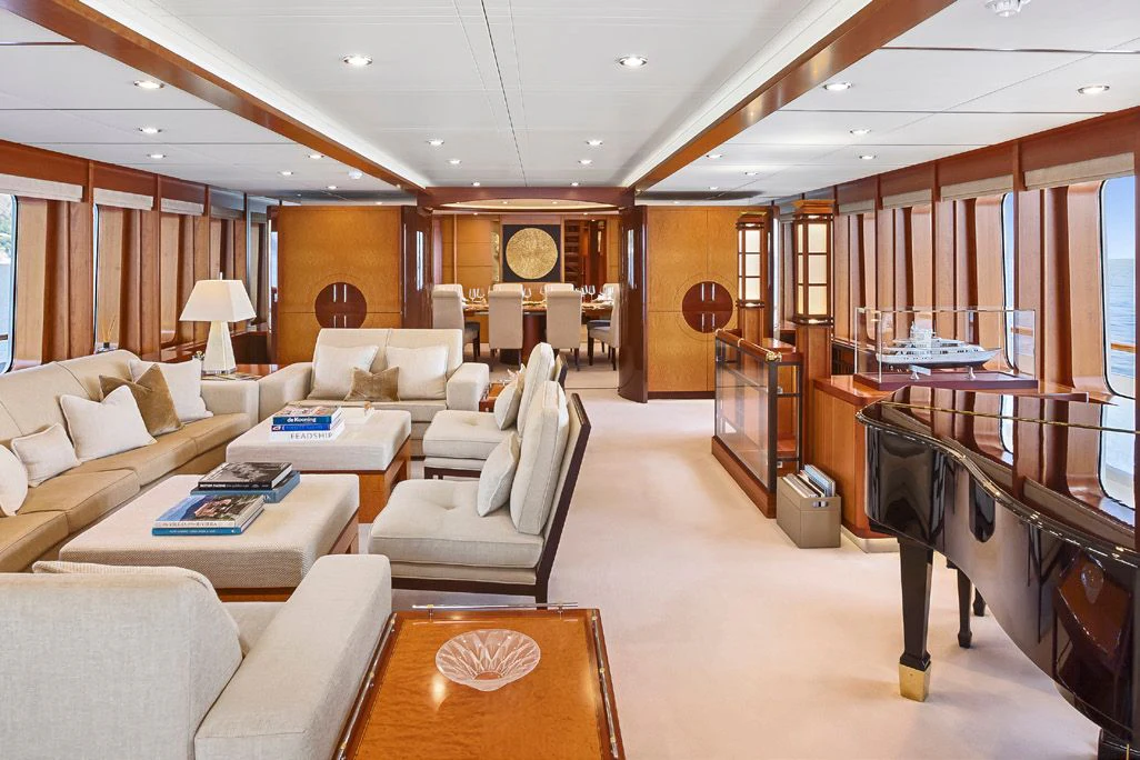a living room with a piano aboard HERCULES Yacht for Sale
